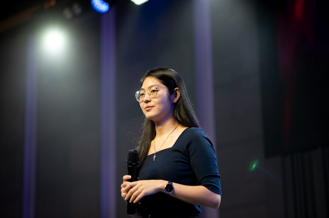confident speaker on stage