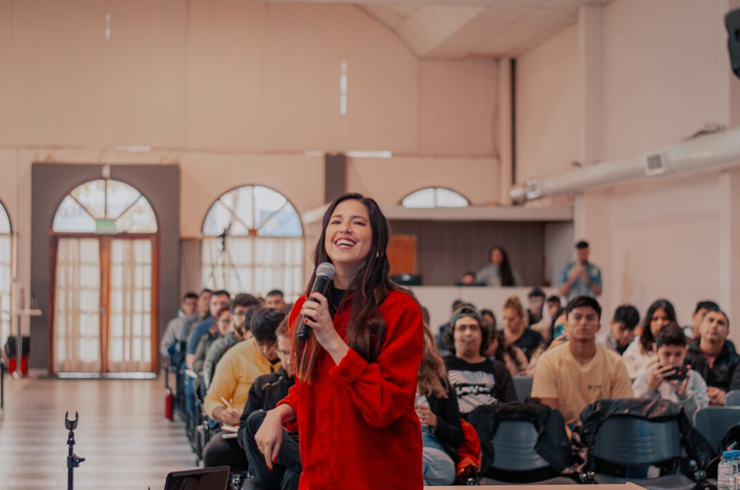 woman presenting on stage