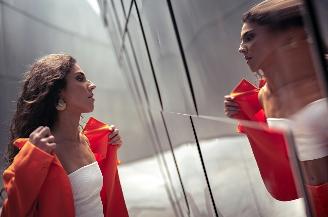 woman practicing speech in mirror