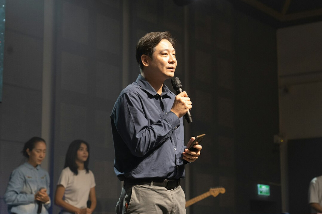person giving speech on stage