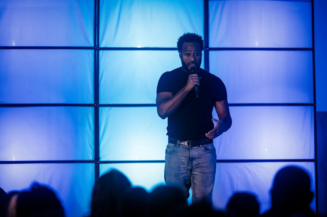 person giving speech on stage