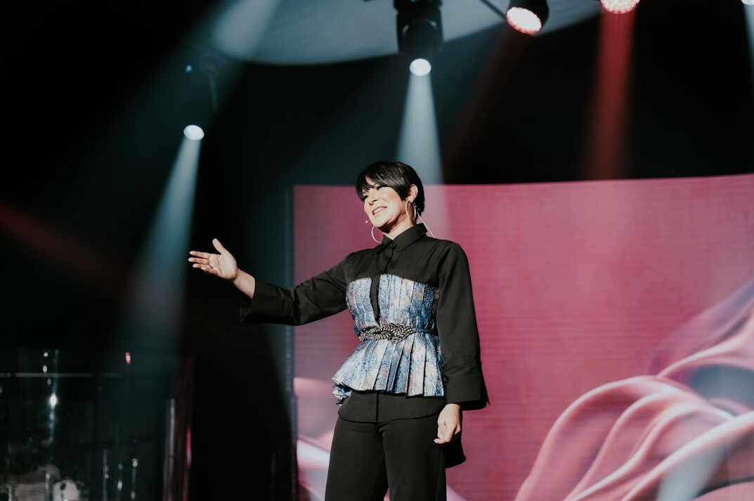 woman presenting on stage