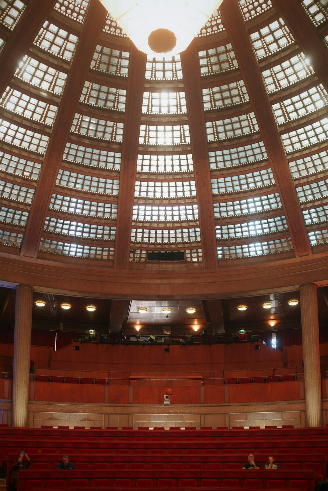 Empty auditorium with a single spotlight on the stage
